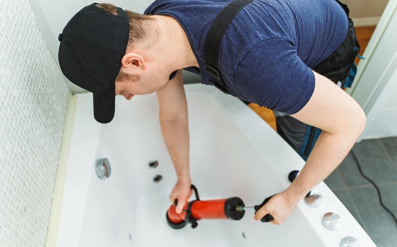 Plumbers Working on Bathtub